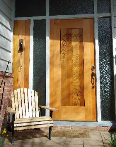 Hand carved leaf and vine exterior door