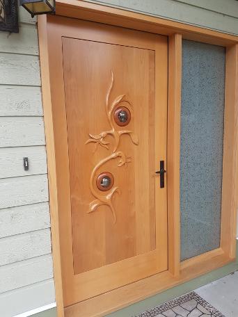 Don Bastian Carved vine leaf exterior door with glass balls