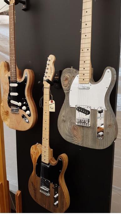 Three hand carved guitars