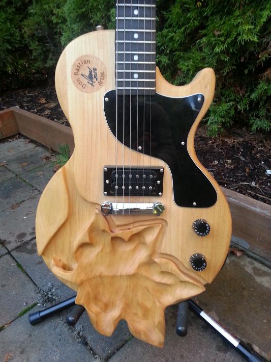 Hand carved maple leaf guitar